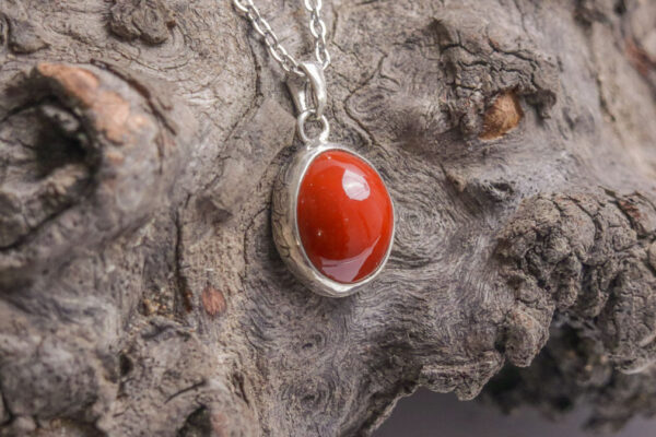 Working on complex surfaces, adding a leaf boarder to frame the red jasper